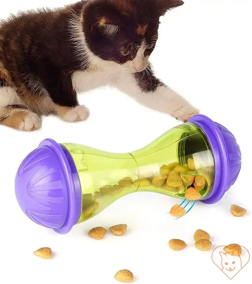 Interactive cat food dispenser toy rolling with treats, engaging cat in play and promoting healthy eating habits.