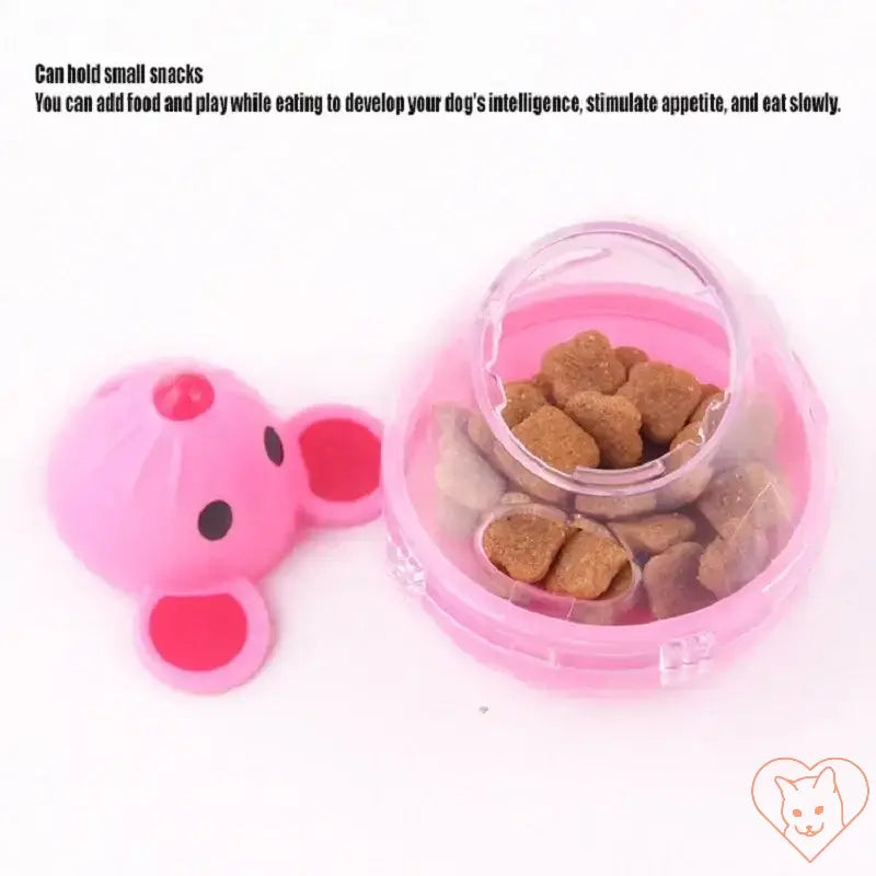 Interactive cat food tumbler in pink, designed to dispense treats while engaging pets in play.