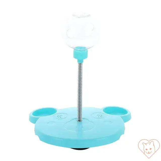 Interactive pet food leaking ball toy with a suction base for cats and dogs in teal color.