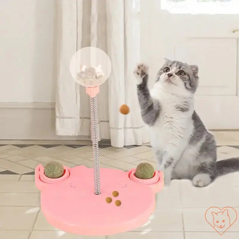 Interactive pet puzzle toy for cats, featuring a pink design with food leaks, promoting fun and engagement.