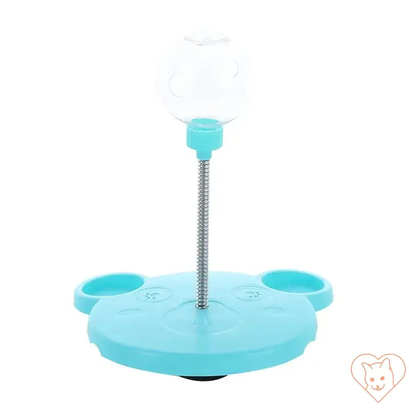 Interactive pet toy featuring a suction cup base and a transparent ball for slow feeding cats and dogs.