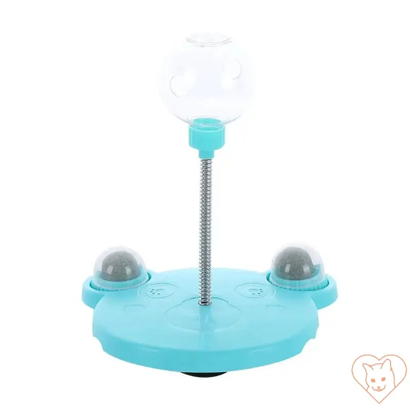 Interactive pet puzzle toy for cats and dogs, featuring a ball and suction cup base for fun treat dispensing.