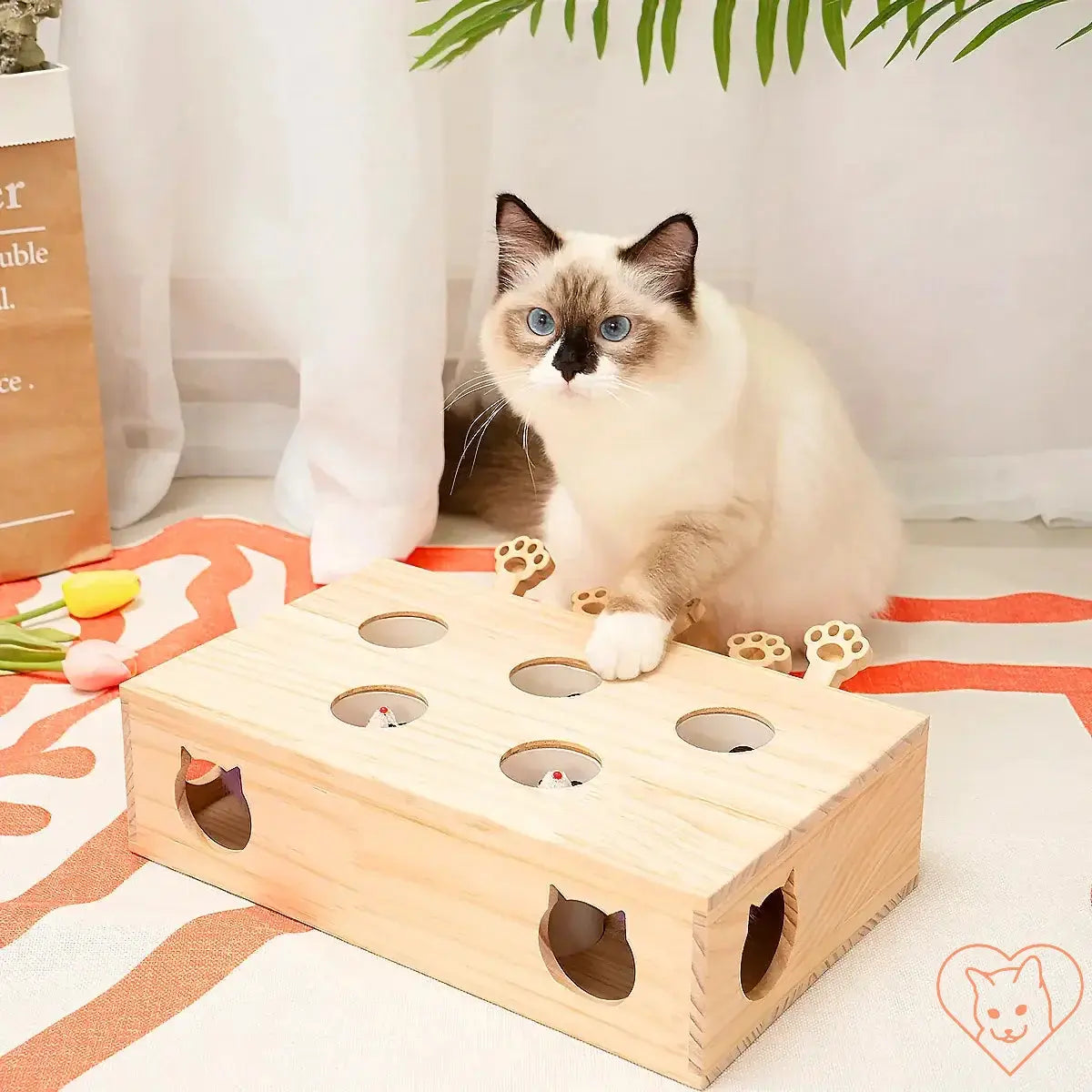 Cat playing with an Interactive Whack-a-Mole toy, engaging and stimulating feline instincts.