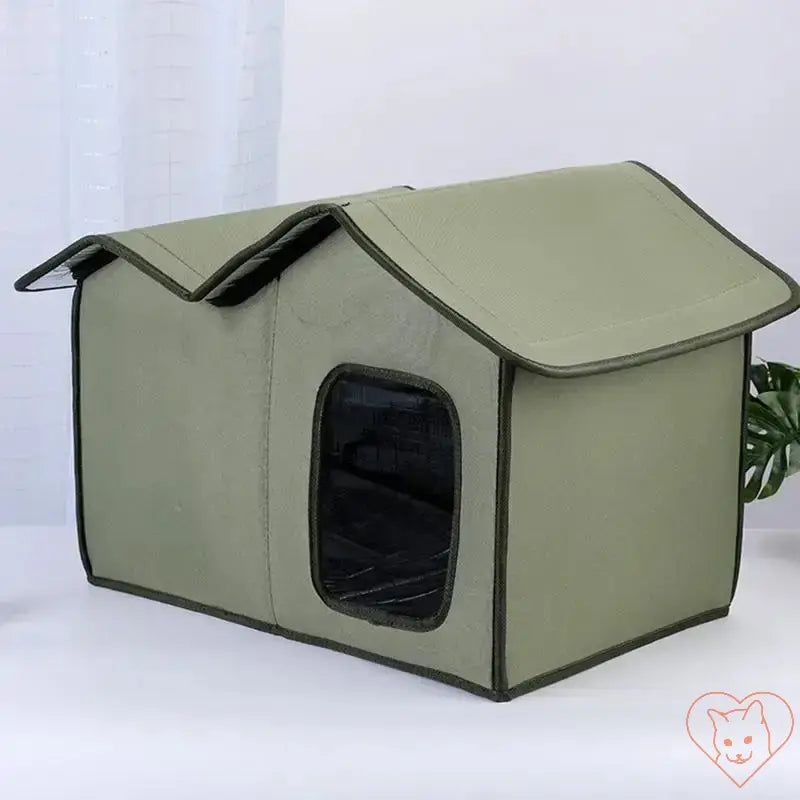 Large insulated cat outdoor shelter in green, waterproof and durable for outdoor and indoor use.