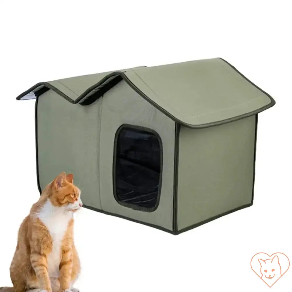 Large insulated cat outdoor shelter in green with a cat sitting beside it, waterproof and weatherproof design.