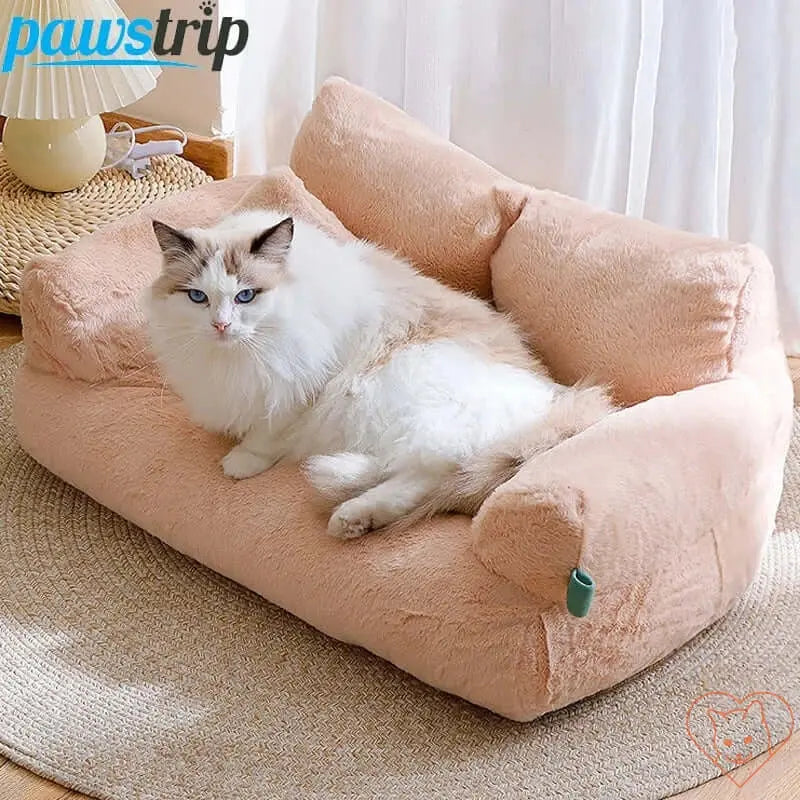 Luxury plush cat bed sofa in soft pink with a fluffy cat relaxing on it, providing ultimate comfort and warmth.