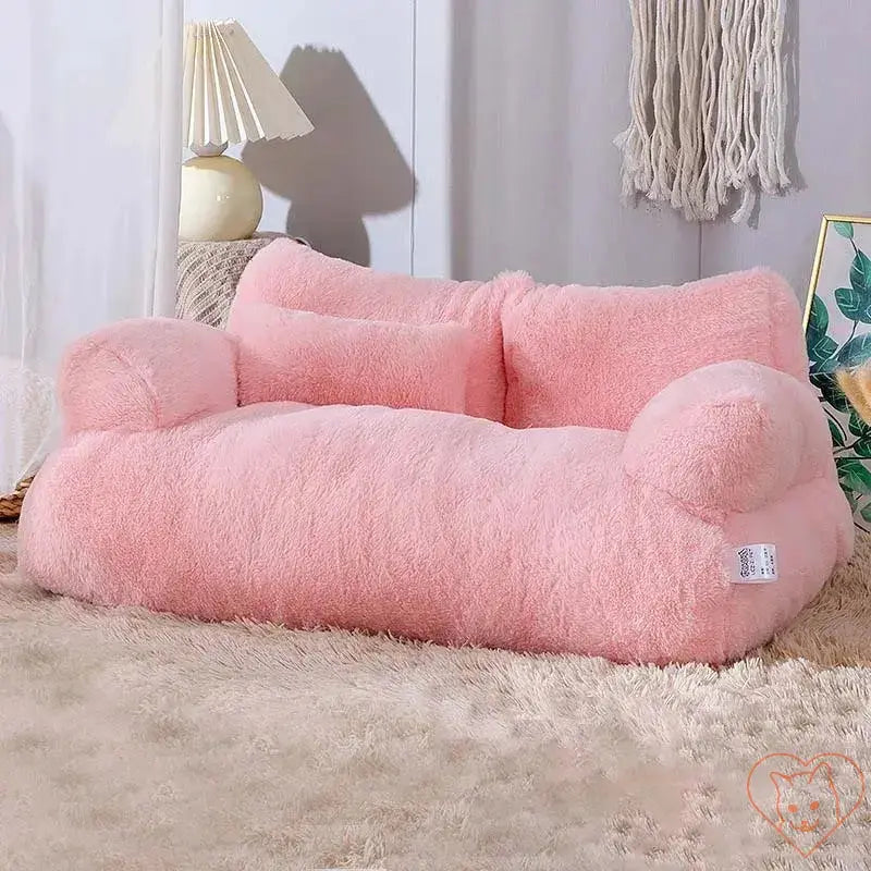 Luxury plush pink cat bed sofa with thick backrest, perfect for small pets to relax in a cozy retreat.