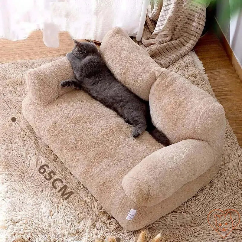 Cozy plush cat bed sofa with a gray cat lounging on it, featuring a thick backrest for support.