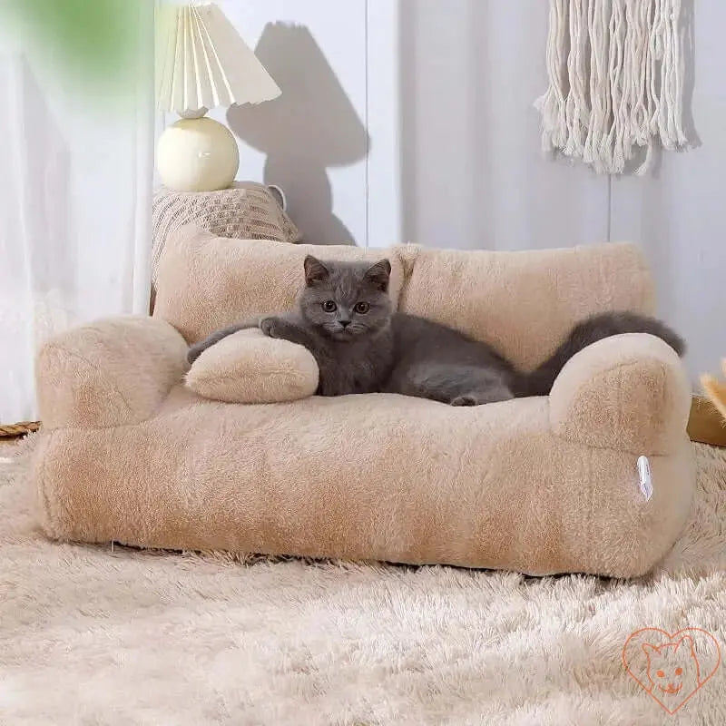 Cozy luxury plush cat bed sofa with a gray cat lounging comfortably on it in a stylish home setting.