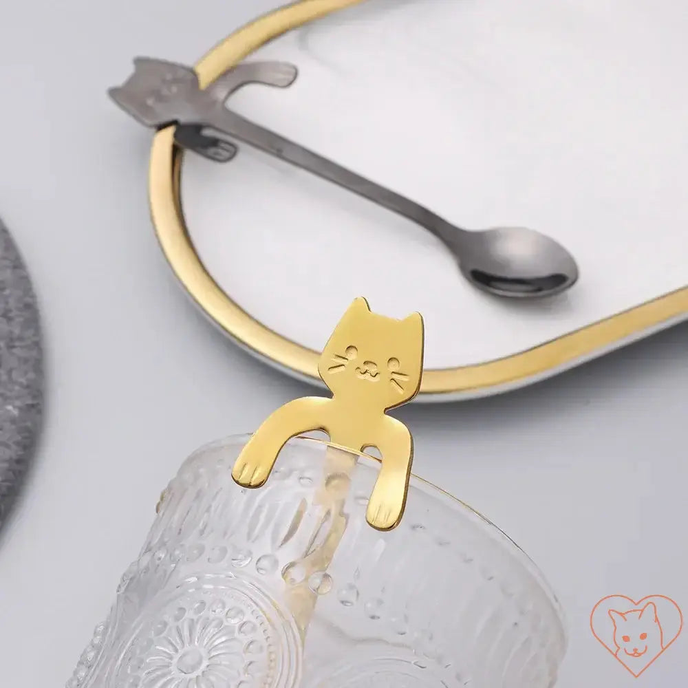 Mini Cat Coffee Spoon in gold design, resting on a glass, perfect for stirring beverages and desserts.