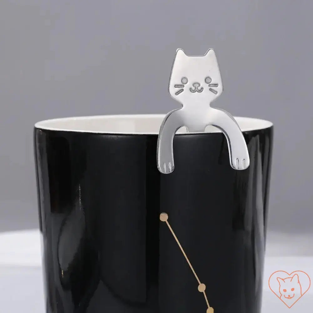 Mini Cat Coffee Spoon perched on a black mug, perfect for coffee and dessert lovers.