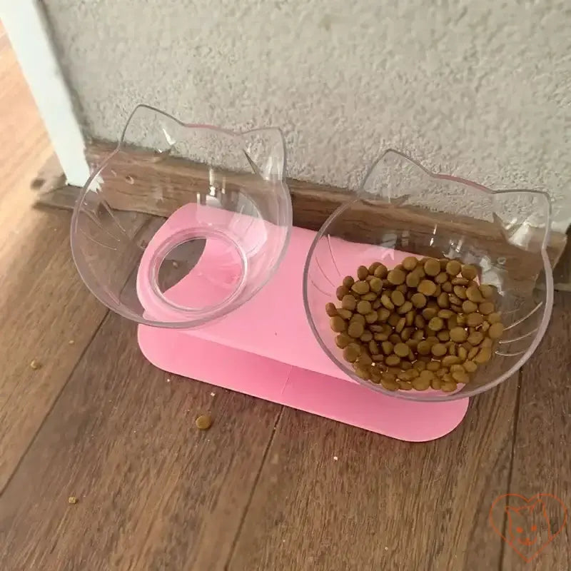 Non-slip double cat bowl with stand, 15° tilt design, suitable for food and water, pink color, ergonomic feeding solution for cats.