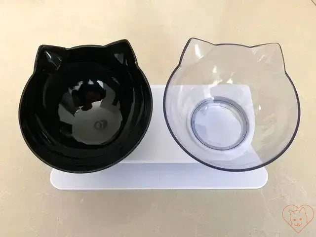 Non-slip double cat bowl with stand, featuring black and clear bowls in a cat ear design for comfortable feeding.