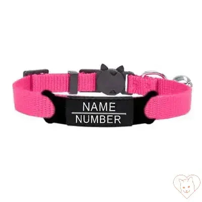 Personalized cat collar in pink with safety breakaway buckle and engraved name and number plate, featuring a bell.