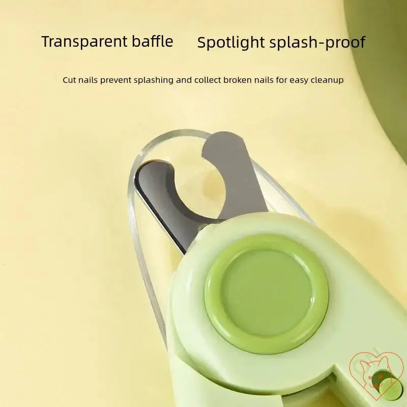 Close-up of pet nail clippers with transparent baffle and spotlight feature for nail grooming safety.