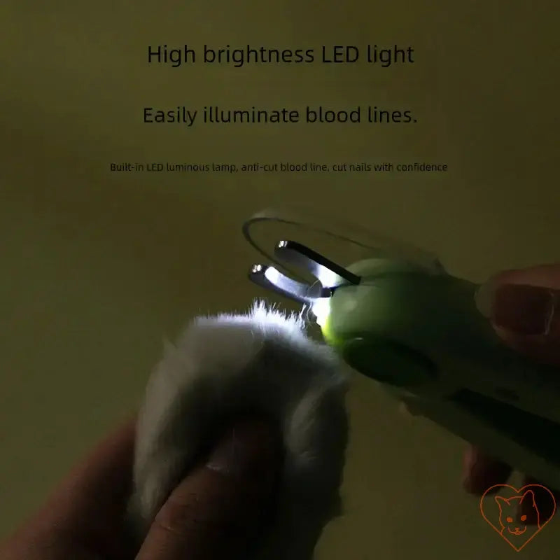 Pet nail clippers with LED light illuminating bloodlines for safe nail trimming of pets.