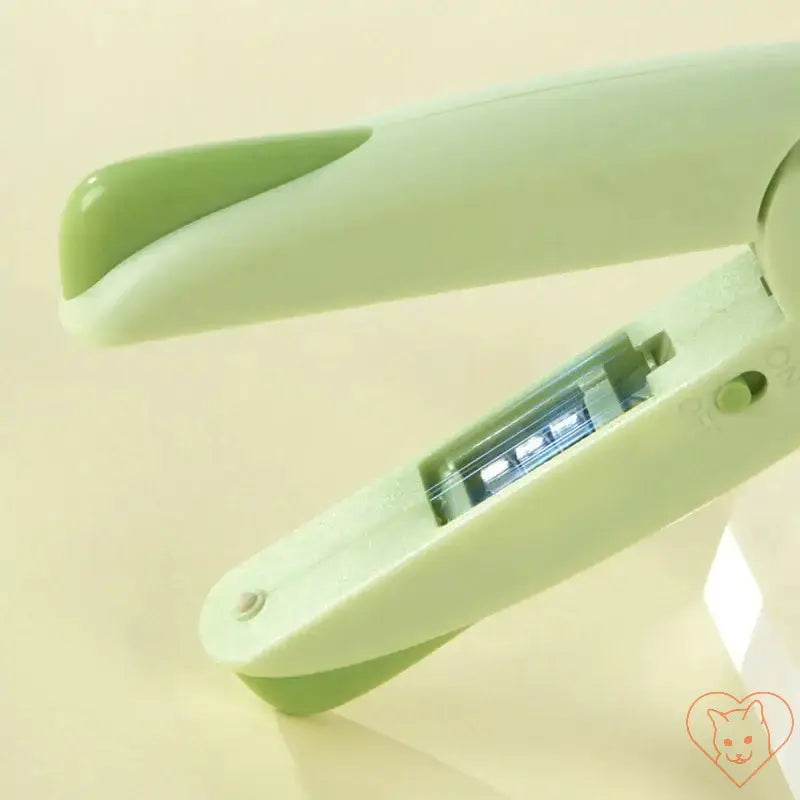 Close-up of Pet Nail Clippers with LED light showing slim design and on/off switch for precise grooming.