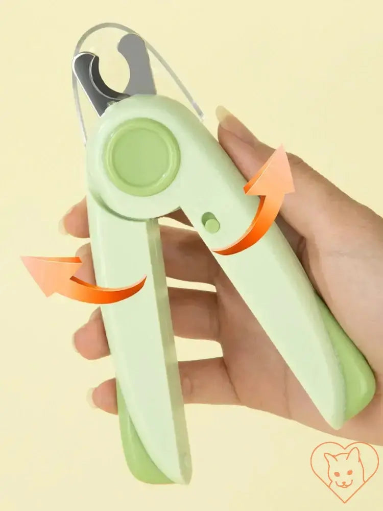 Hand holding Pet Nail Clippers with LED light, showcasing its ergonomic design and sharp stainless steel blade.