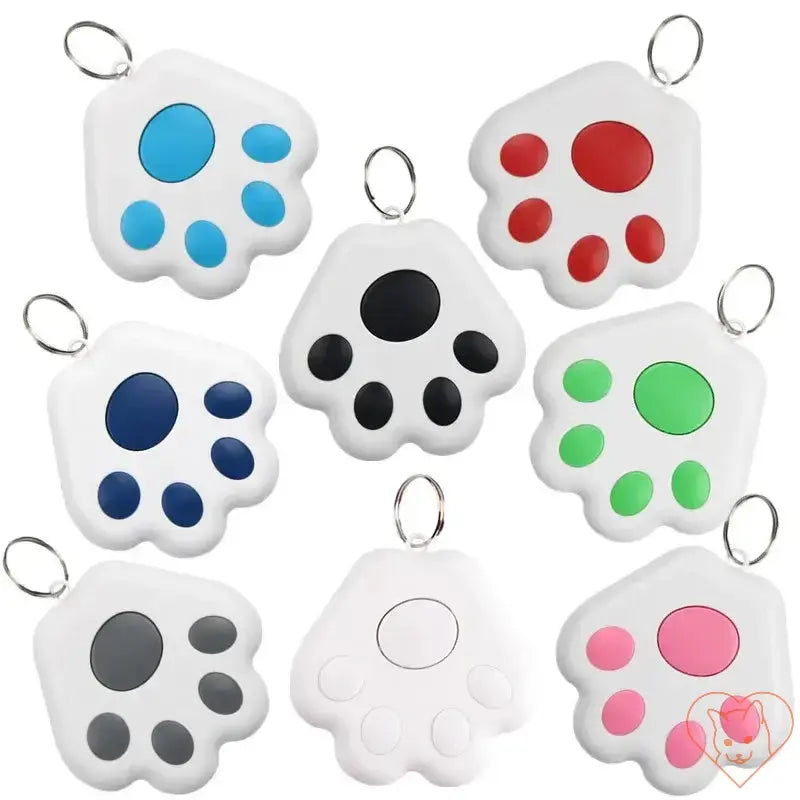 Assorted colors of pet tracking locators designed for cats in paw print shapes, showcasing Bluetooth technology.