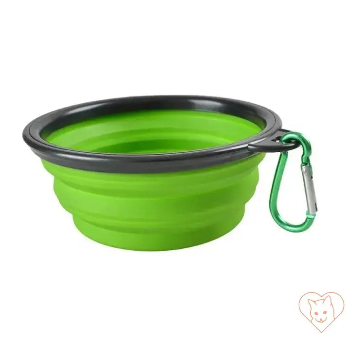 Portable folding silicone pet bowl in green with carabiner for on-the-go feeding and watering.