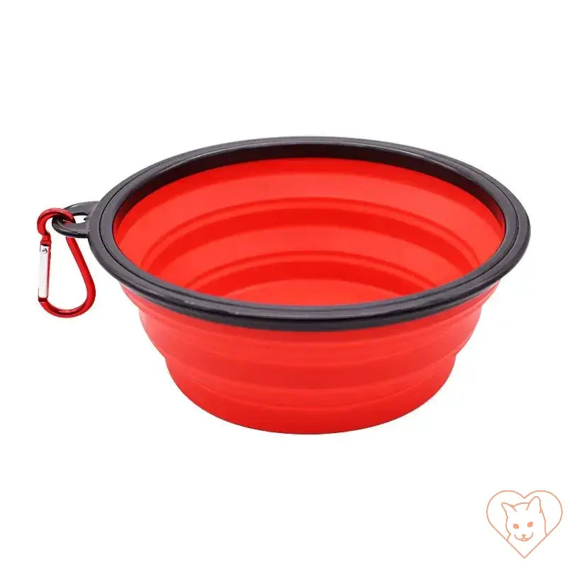 Red portable folding silicone pet bowl with carabiner, perfect for on-the-go feeding and hydration for small pets.