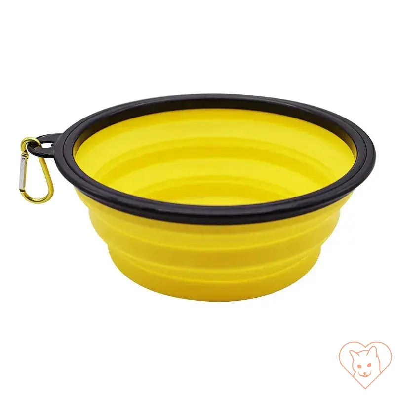 Portable folding silicone pet bowl in yellow with carabiner for easy travel and outdoor use.