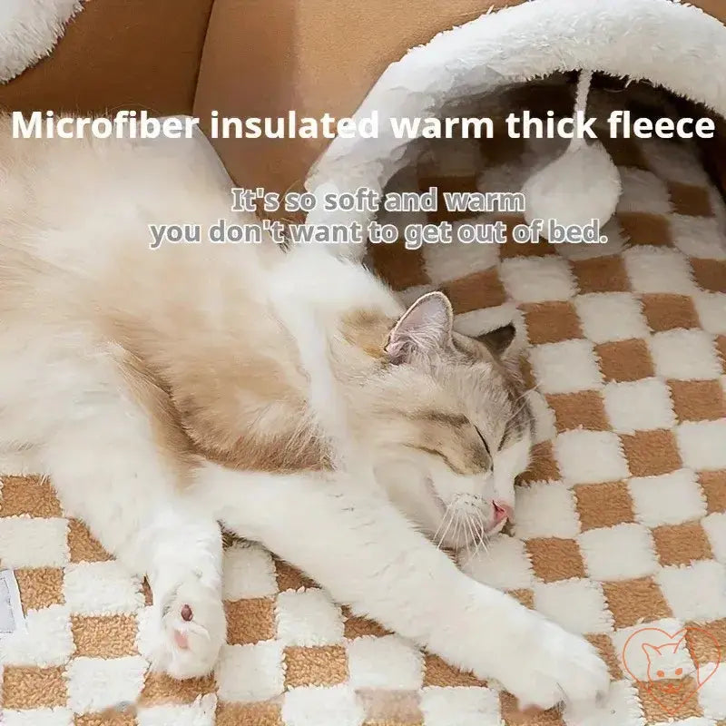 Cozy cat sleeping on warm microfiber fleece bed, showcasing plush comfort and inviting design for indoor relaxation.