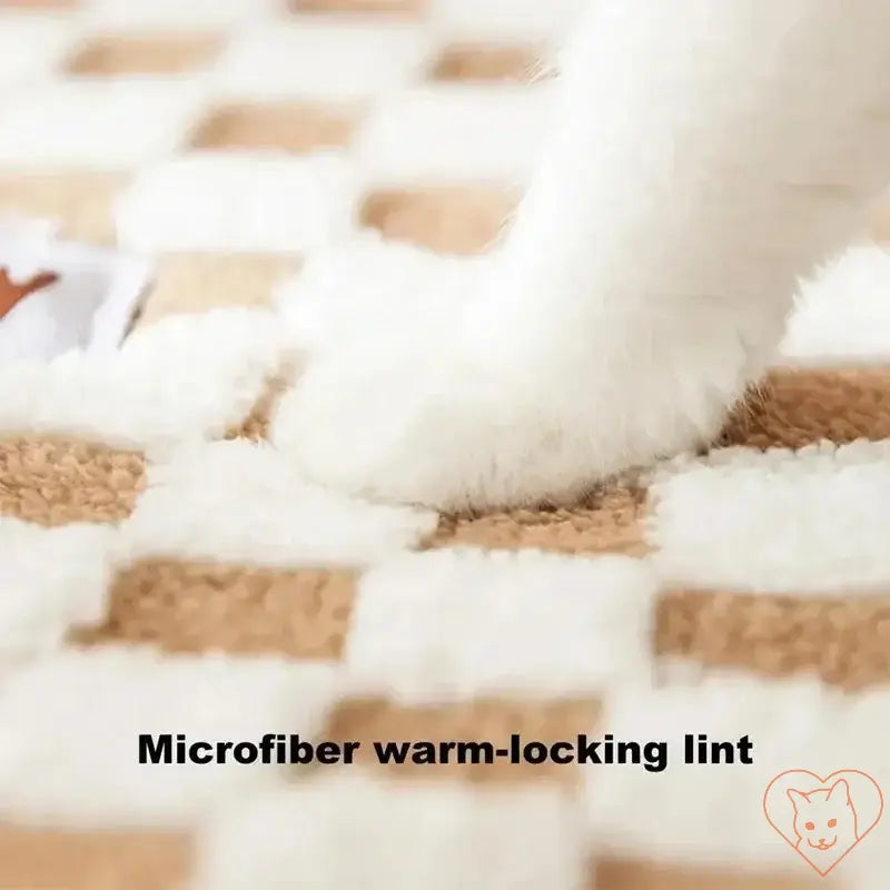 Cat paw on a cozy microfiber warm-locking lint rug, perfect for providing warmth and comfort during winter.