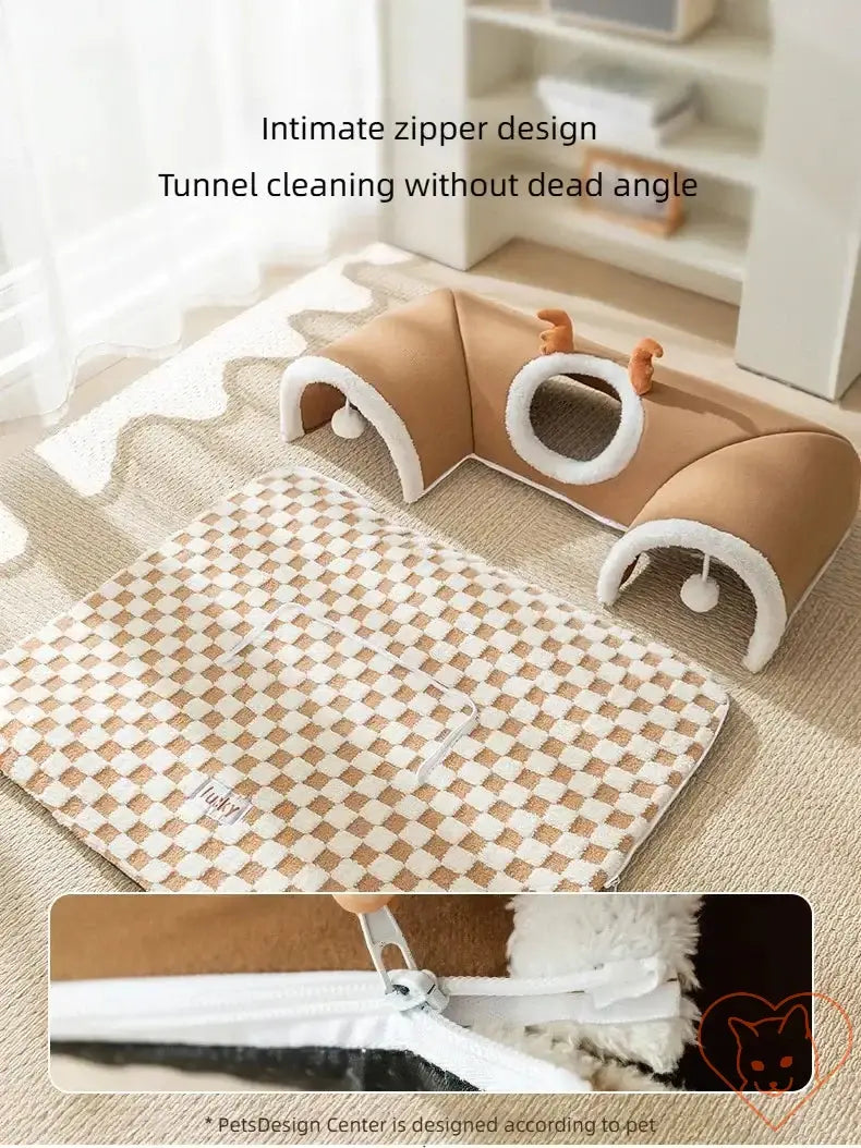 Cozy reindeer plush cat bed and tunnel showing zipper design for easy cleaning and plush sleep area.