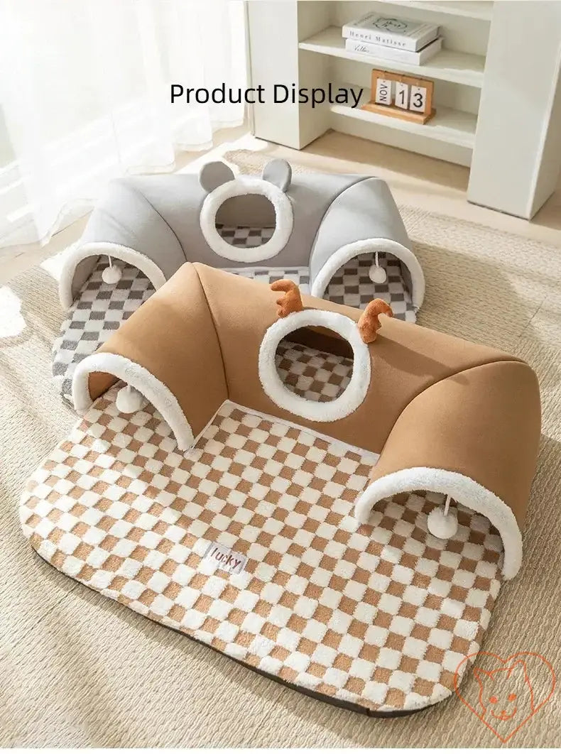 Cozy reindeer plush cat bed and tunnel set in warm tones, perfect for winter play and sleep, displayed in a bright room.