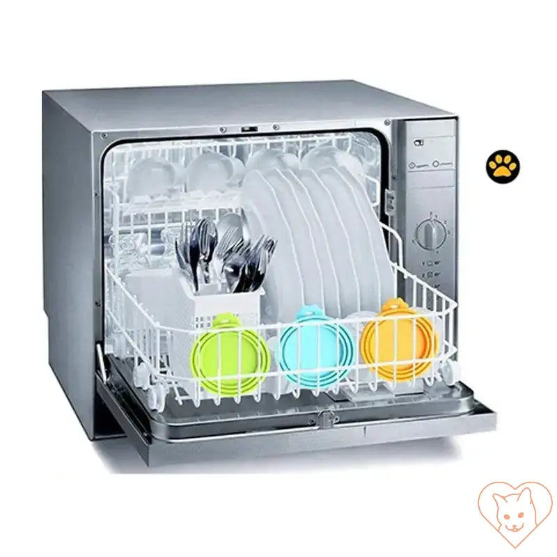 Dishwasher loaded with clean dishes and pet food containers in blue, yellow, and green for safe cleaning.