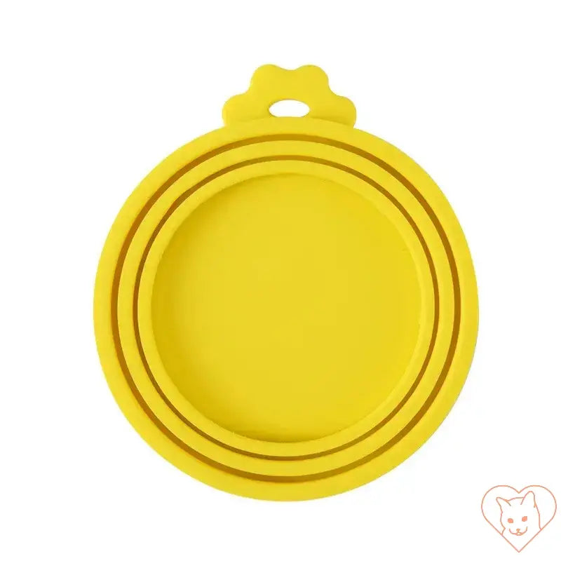 Yellow silicone pet food can cover designed to keep pet food fresh and odor-free.