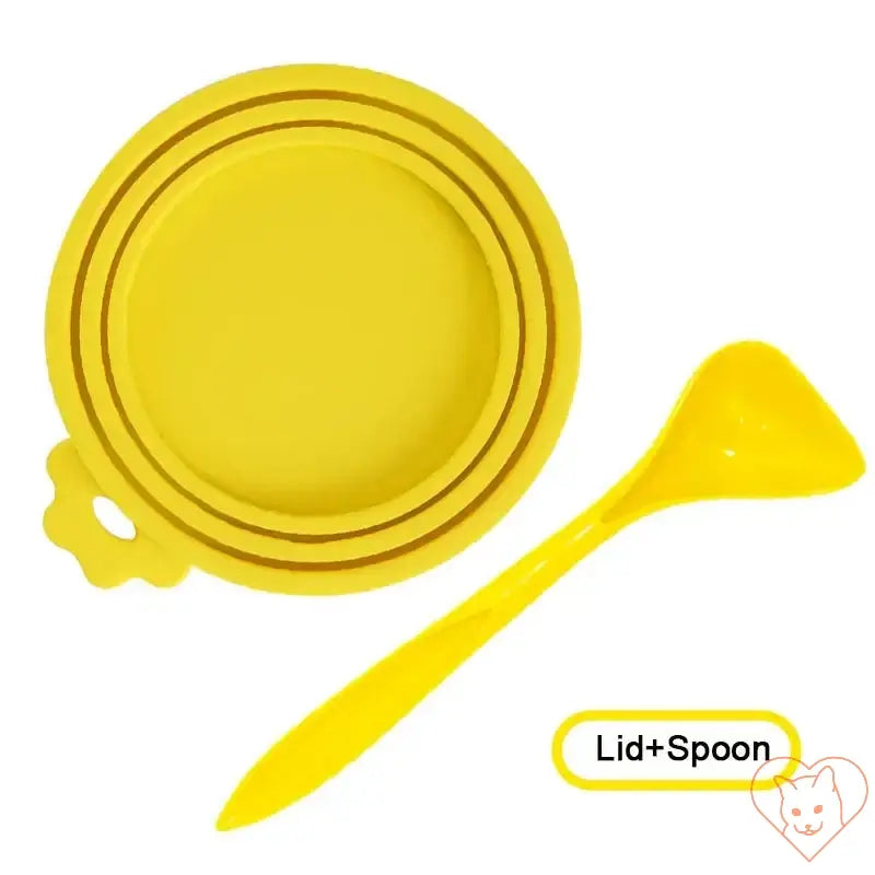 Reusable yellow silicone pet food can cover and spoon set for sealing and scooping pet food.