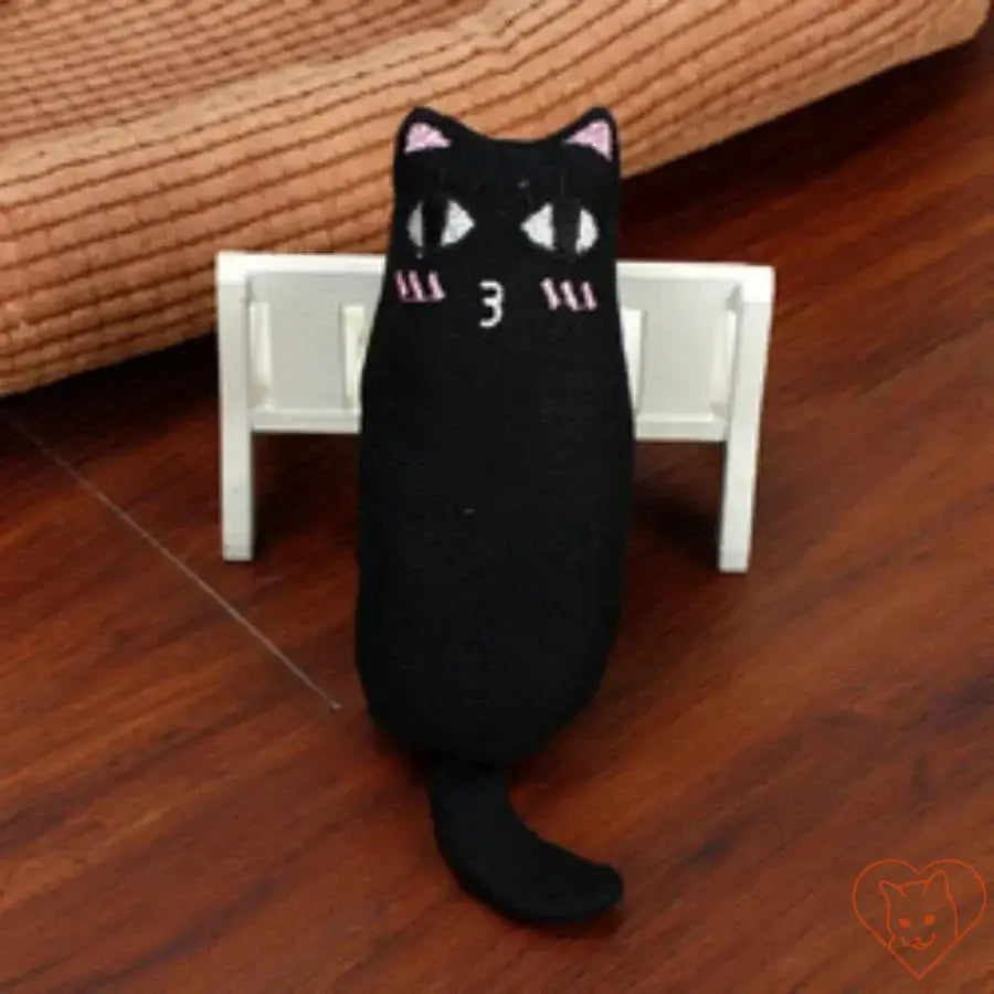 Black cat plush toy resembling a thumb pillow, perfect for playful cats, featuring a cute face design.