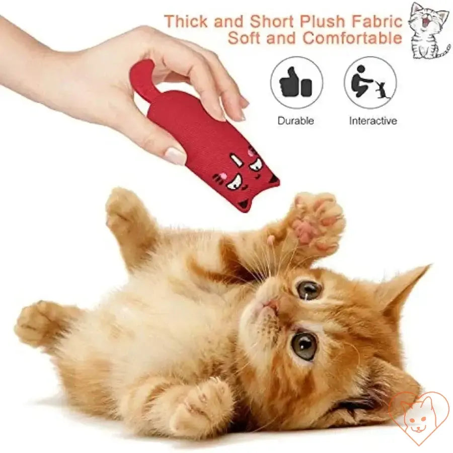 Orange kitten playing with red catnip plush toy, showcasing its soft, durable design for interactive pet fun.