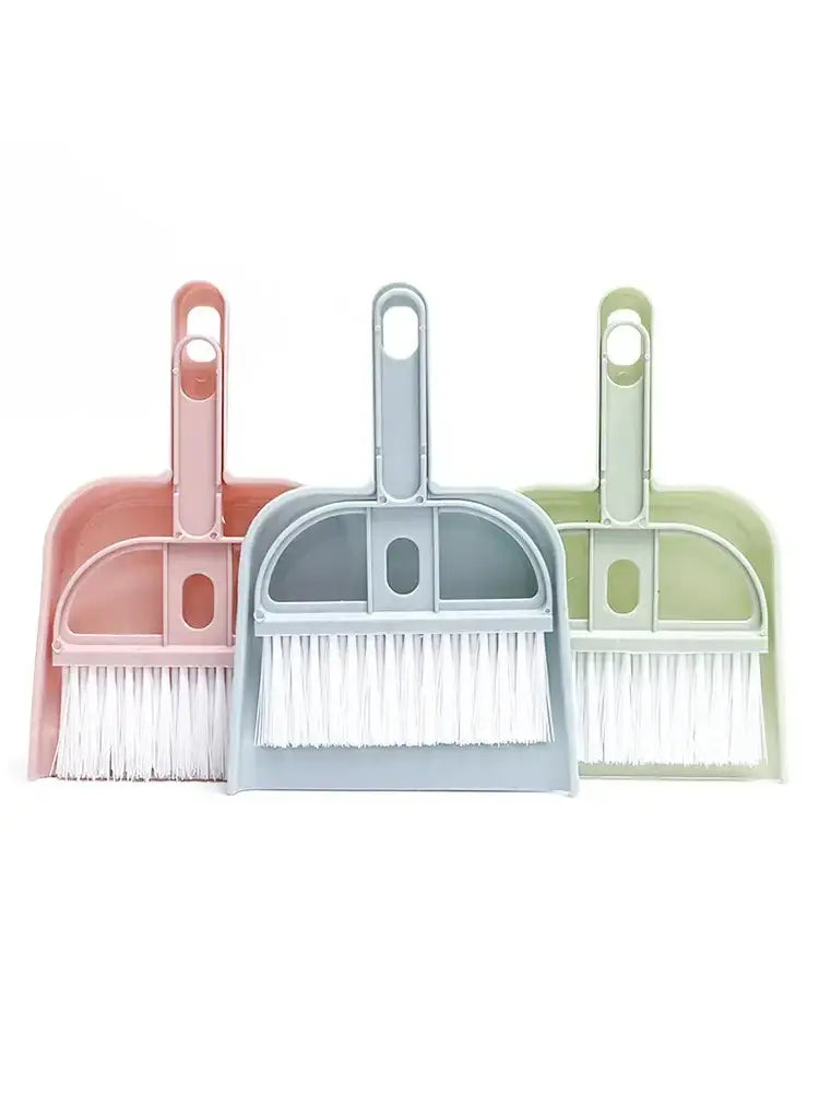 Small broom set with colorful dustpans in pink, gray, and green, ideal for quick clean-ups and pet messes.