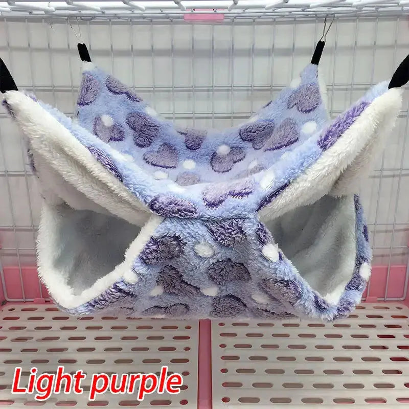 Light purple Thick Plush Hanging Tree Bed for cats, featuring soft coral and arctic fleece design, cozy hammock style.