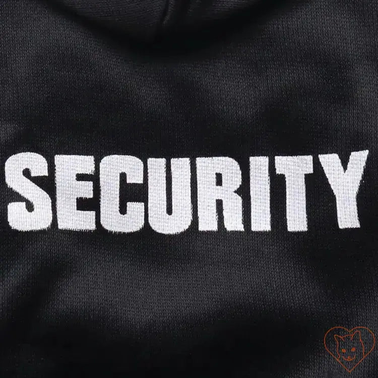 Close-up of 'SECURITY' lettering on black pet hoodie for stylish and cozy cat wear.