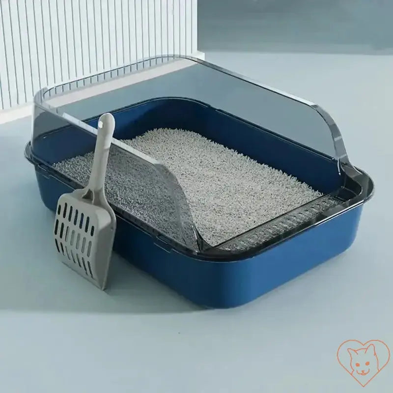 Semi-enclosed cat litter box in blue with litter and scoop, designed for easy cleaning and compact spaces.