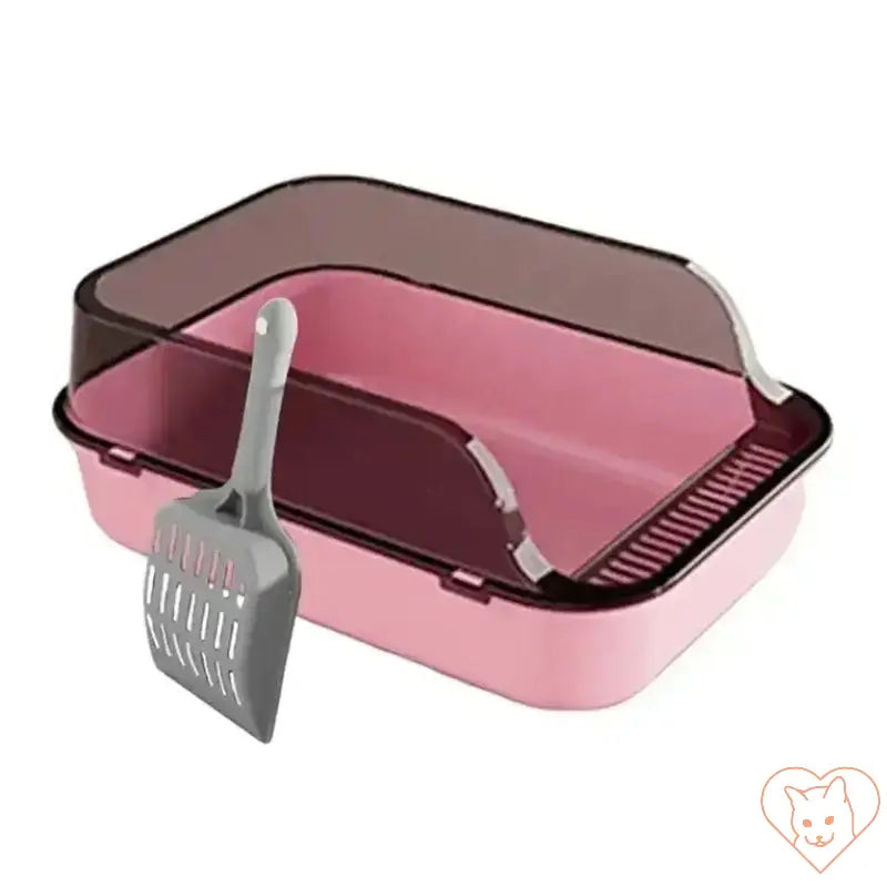 Semi-enclosed pink cat litter box with a gray scoop, designed for easy cleaning and compact spaces.