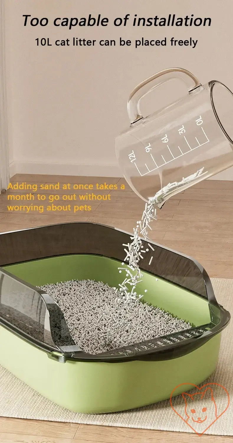 Cat litter being poured into a semi-enclosed high-sided litter box with a splash-proof design.