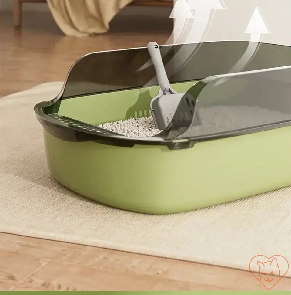 Semi-enclosed open cat litter box with high sides and scooper, designed for cleanliness and comfort in homes.