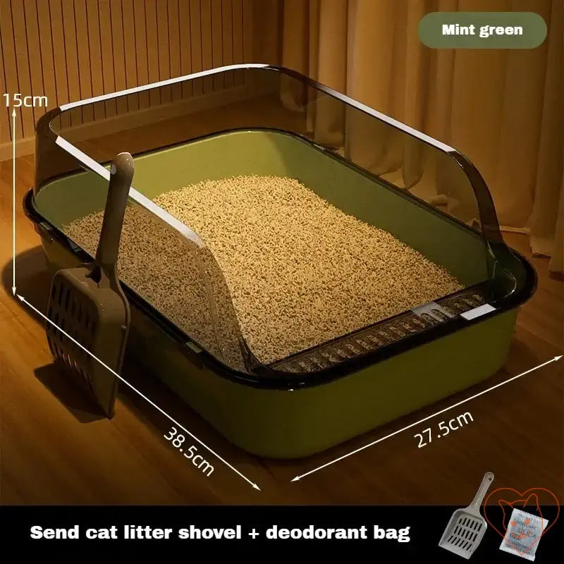 Semi-enclosed mint green cat litter box with high sides and included shovel, providing comfort and cleanliness for cats.