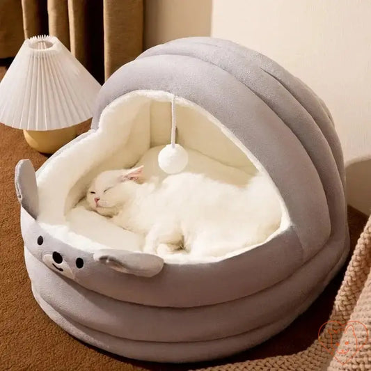 Cozy semi-enclosed plush cat bed with a sleeping white cat, perfect for autumn and winter comfort.