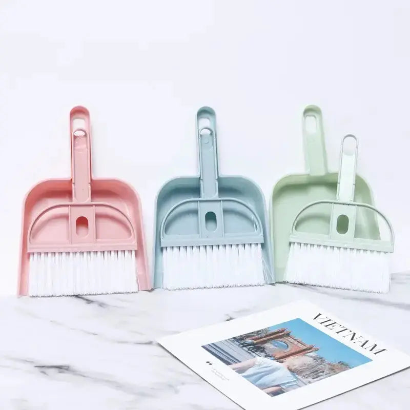 Colorful small broom and dustpan set for quick clean-ups, ideal for pet messes in tight spaces.