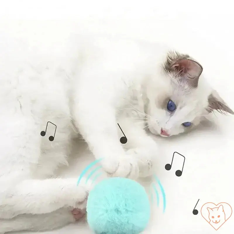 White cat playing with Smart Electric Catnip Ball that makes realistic animal sounds.