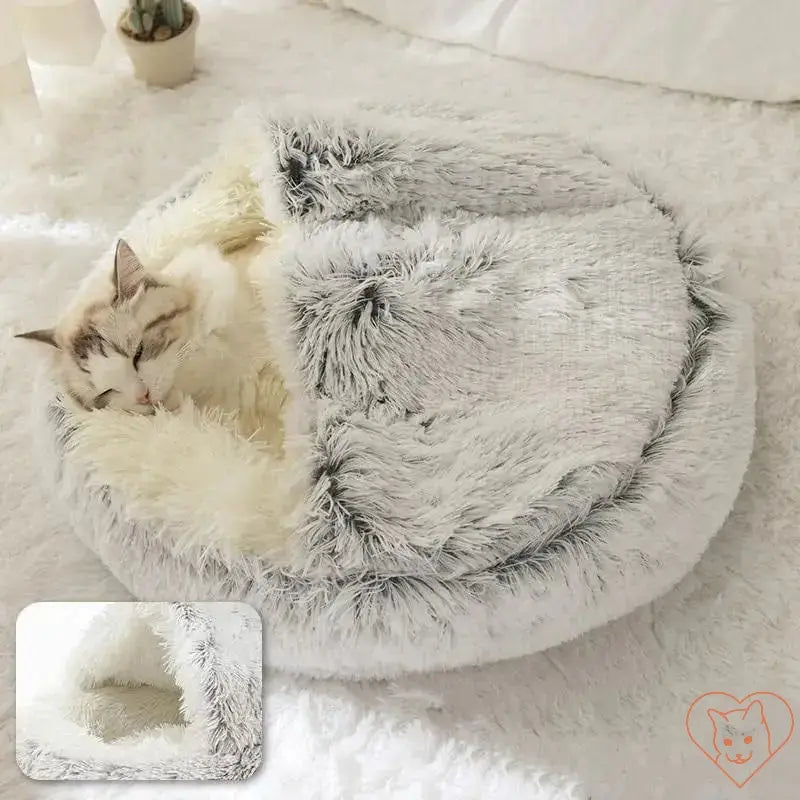 Cozy cat sleeping in a soft plush 2-in-1 cat bed with cover, providing warmth and comfort.