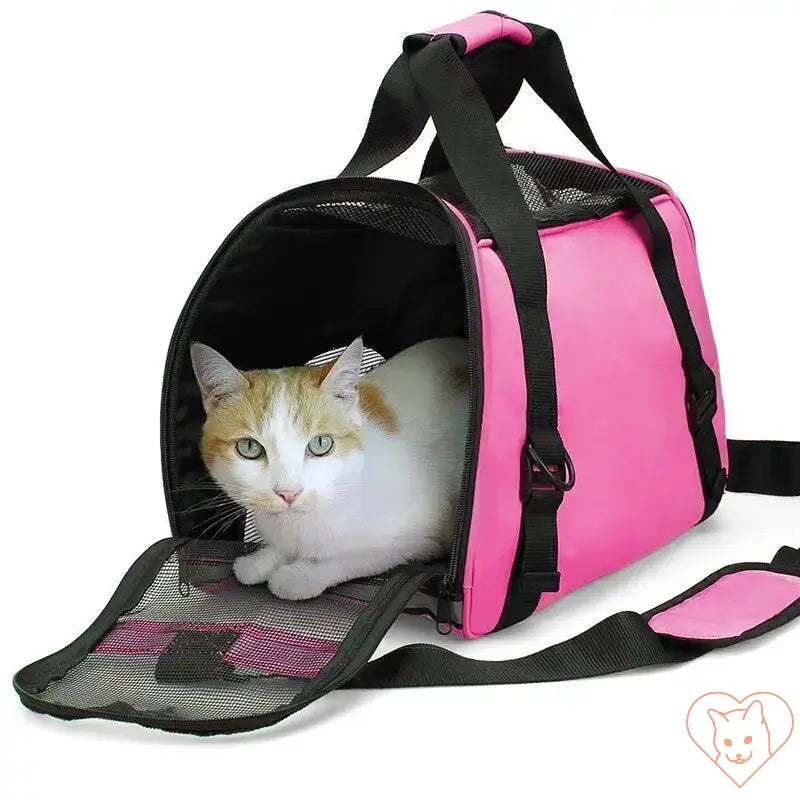 Soft-sided pink cat carrier with a cozy cat inside, perfect for travel with pets.