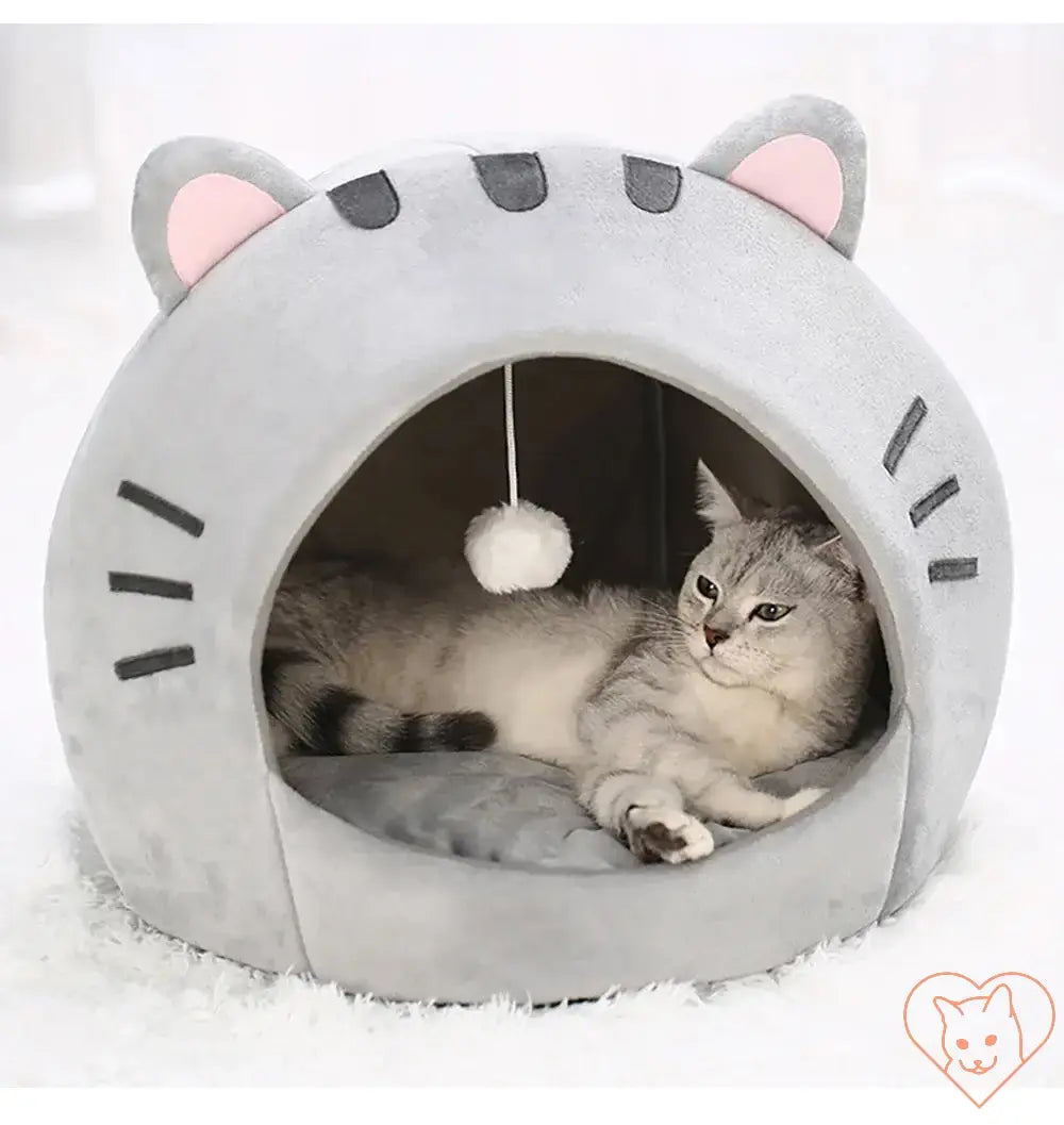 Cozy gray cat bed with ears, semi-enclosed design, featuring a hanging toy, perfect for cats and small dogs.