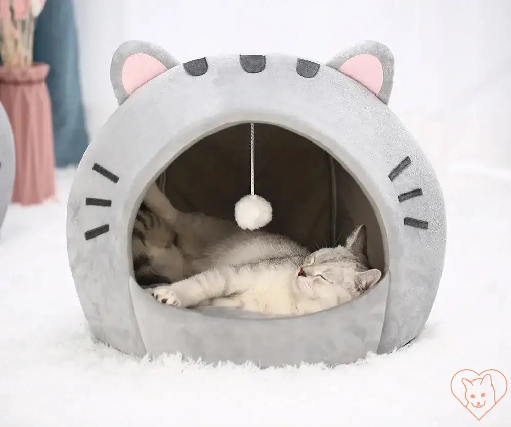 Cozy Super Cat Bed with gray cave design and hanging toy, perfect for feline relaxation and comfort.